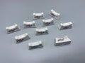 10 repose-couteaux porcelaine blanche – Bouquet de roses polychrome