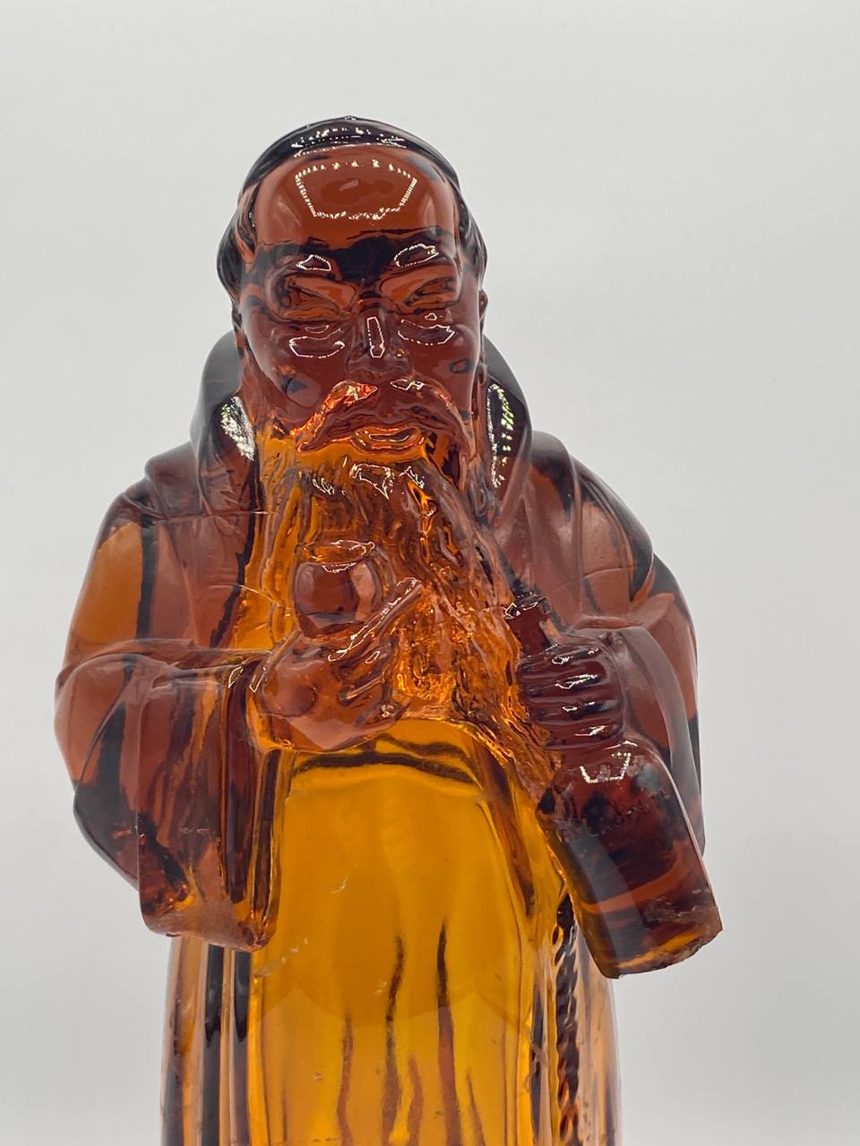 Bouteille figurine en verre ambré moulé – Sage oriental barbu – Lejay-Lagoute Dijon