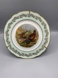 Assiette murale en porcelaine de Limoges à décor de faisans, XXe siècle