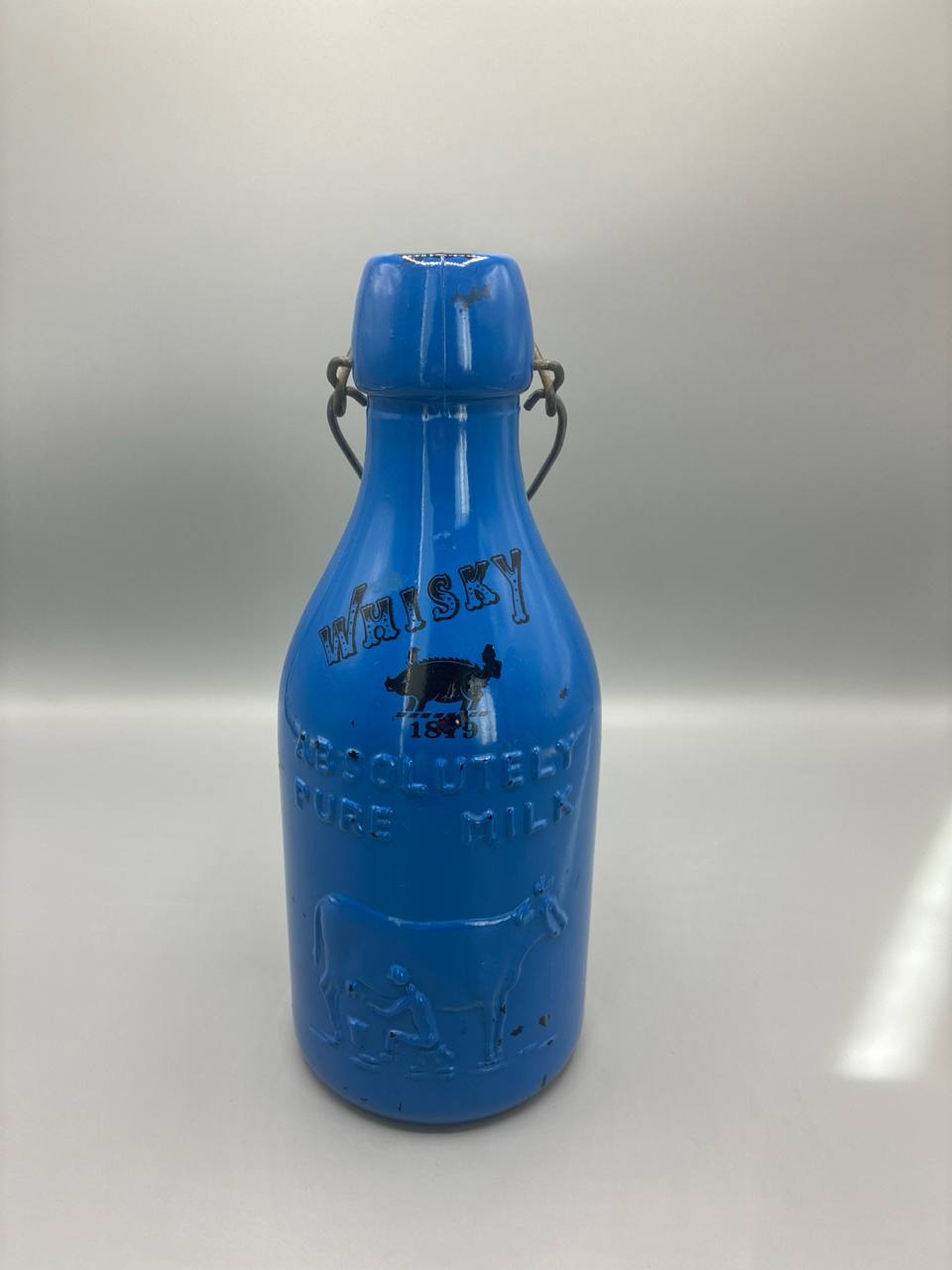 Bouteille vintage bleu bouchon mécanique lait whisky déco rétro