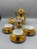 Service à café 8 pièces porcelaine dorée Bareuther Bavaria décor floral vue d'ensemble