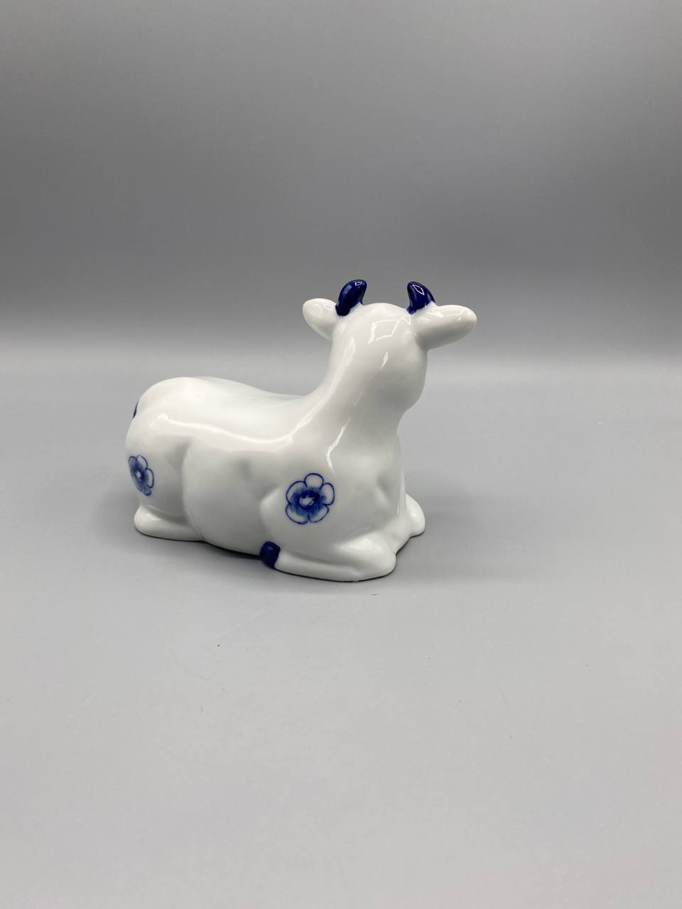 Fond de la figurine, ouvert, inscription cursive Digoin et vignette polychrome pont-canal visibles