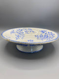 Compotier Creil et Montereau, vue de face, décor japonisant bambou et fleurs de prunier bleu sur fond ivoire, frise perlée au bord