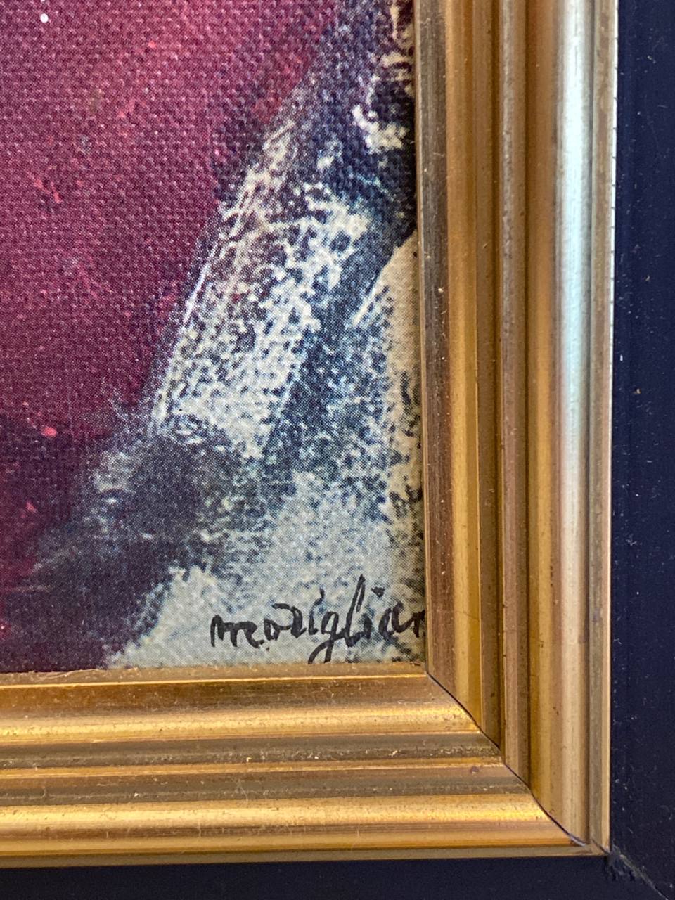 Dos de la reproduction encadrée, carton kraft avec fil de suspension en corde blanche, clou central, cadre doré visible sur les bords