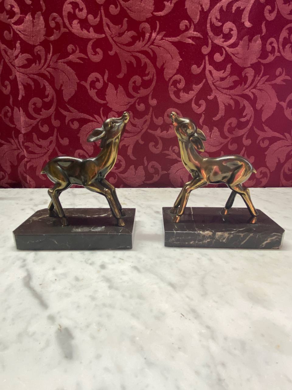 2 serre-livres faons régule bronzé sur socle marbre noir Art Déco