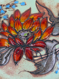 Plat mural céramique de Vallauris – Fleur solaire rouge et orange – Signé La Grange – Années 1960–1970