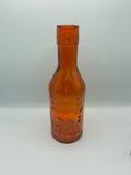Ancienne bouteille à lait ambrée « Absolutely Pure Milk » – The Milk Protector – vers 1900