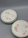 Ensemble de six sous-tasses Jean Pouyat Limoges à fleurs roses