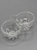 Double saleron en verre pressé transparent à décor floral et éventails