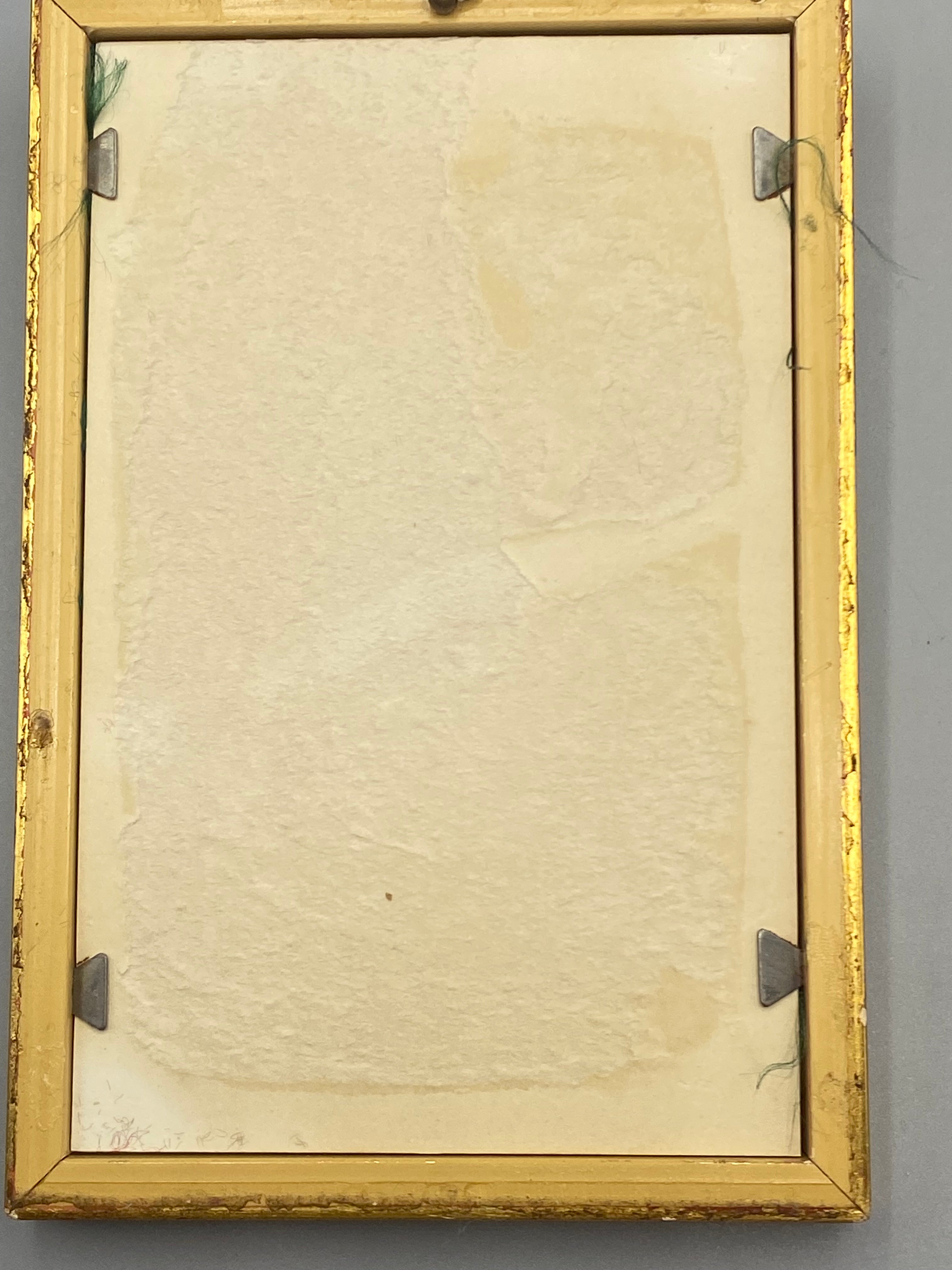 Revers du cadre doré, système d'accrochage mural