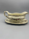 Saucière Schumann Arzberg – vue de face, décor floral polychrome et filets or