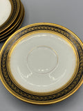 Ensemble de sept sous-tasses anciennes en porcelaine noir et or