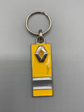 Porte-clés Renault vintage jaune et noir avec losange métallique en relief