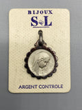 Médaille ancienne Vierge Marie en argent à entourage festonné sur cartonnage Bijoux S et L
